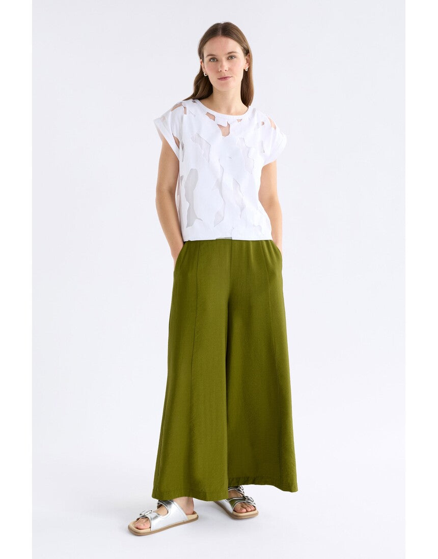 White Varr Burnout Top by ELK The Label, featuring lightweight fabric and relaxed fit, shown hanging on a hanger.