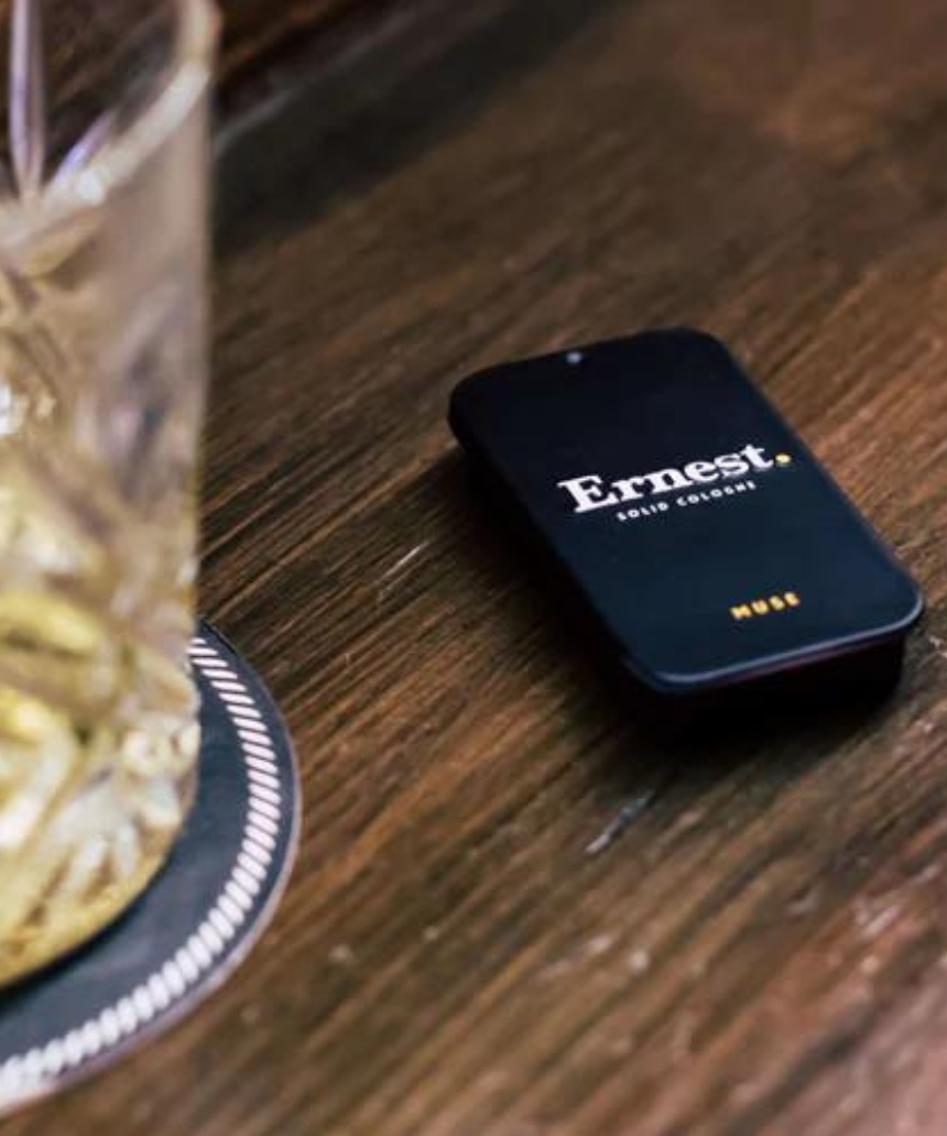 Ernest Muse Solid Cologne jar with black lid and minimalist label, showcasing the compact, portable fragrance container.