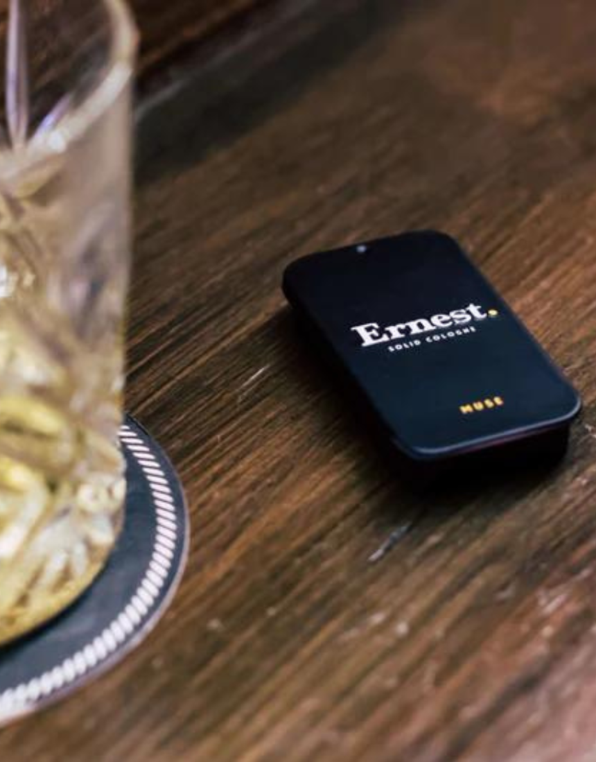 Ernest Muse Solid Cologne jar with black lid and minimalist label, showcasing the compact, portable fragrance container.