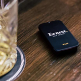 Ernest Muse Solid Cologne jar with black lid and minimalist label, showcasing the compact, portable fragrance container.