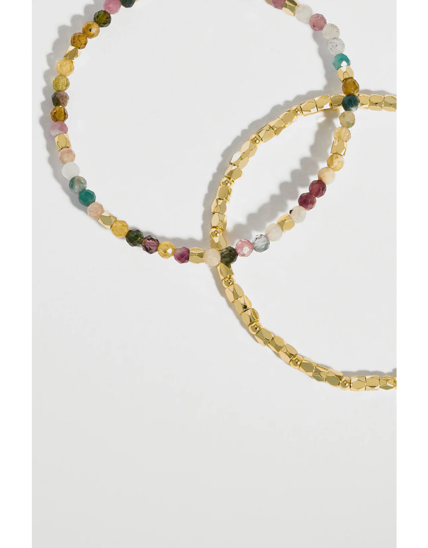 Estella Bartlett Coco & Tourmaline bracelet featuring a delicate chain and colorful tourmaline stones on a jewelry display.