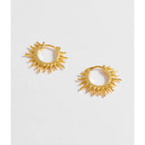 Estella Bartlett Sun Huggie Hoop Earring featuring a small sun charm on gold-tone hoop earring, perfect for everyday wear.