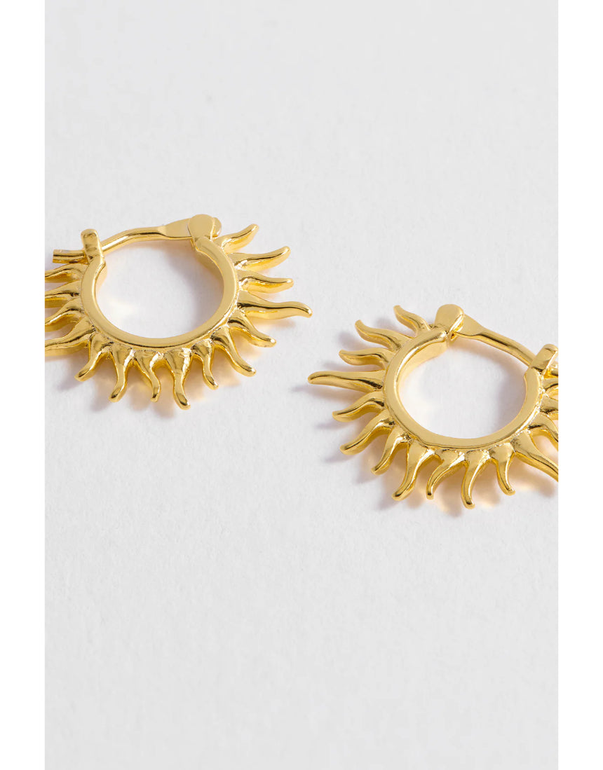 Estella Bartlett Sun Huggie Hoop Earring featuring a gold-tone sun design and small hoop style, perfect for everyday wear.