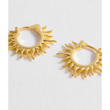 Estella Bartlett Sun Huggie Hoop Earring featuring a gold-tone sun design and small hoop style, perfect for everyday wear.