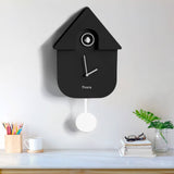 Fisura Casita Black cuckoo clock with a charming black wooden house design and traditional clock face.