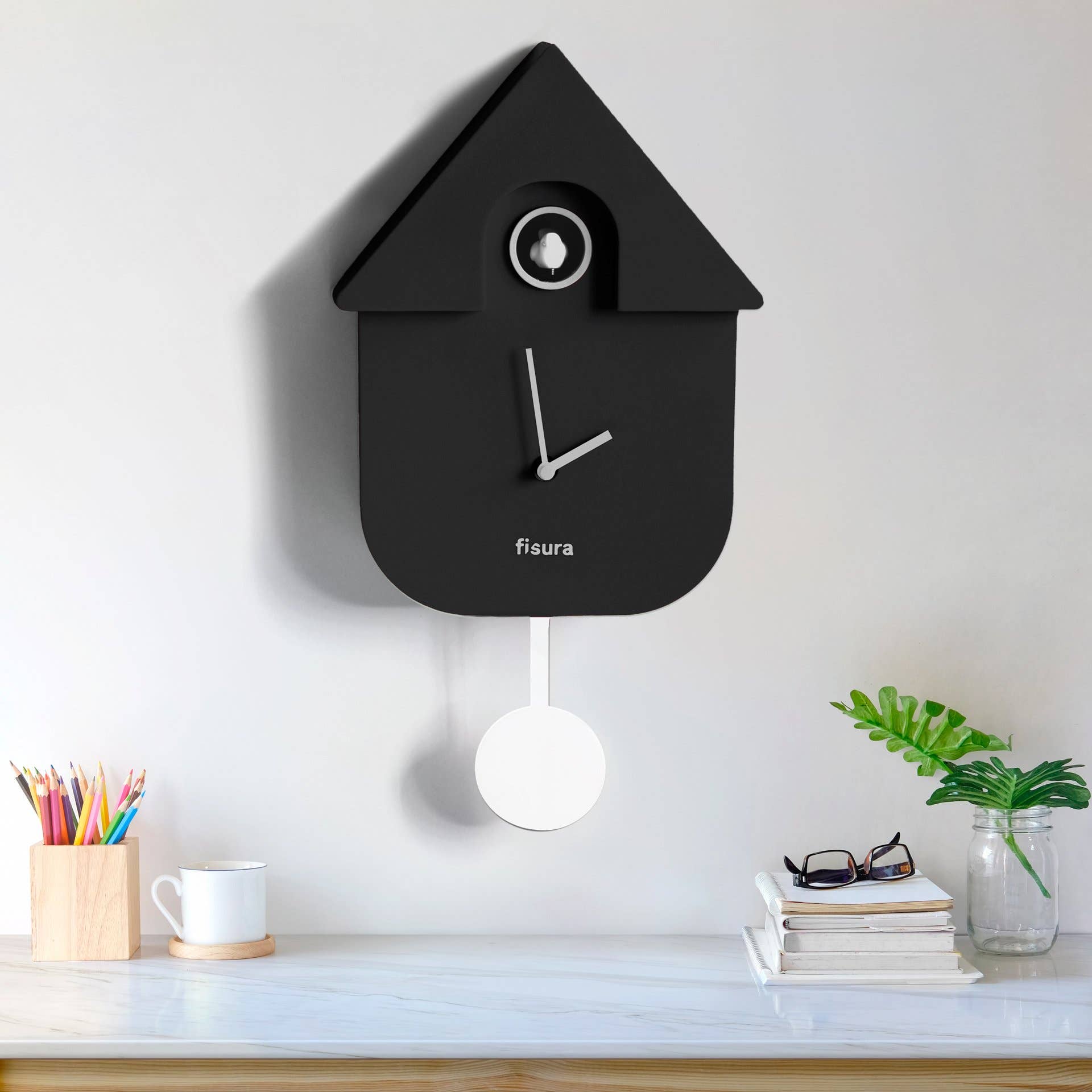 Fisura Casita Black cuckoo clock with a charming black wooden house design and traditional clock face.