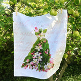 Petal & Pins floral linen tea towel with apple blossom design, showcasing a delicate, natural linen fabric and vibrant floral pattern.