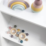 Living Textiles multi-surface teething wheel in steel blue with textured and smooth surfaces for soothing teething relief.