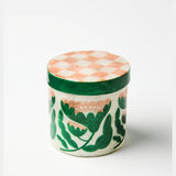 Jones & Co Paradis Pink medium trivet with floral design, featuring a round pink ceramic surface and decorative edge.