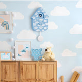 Fisura cuckoo clock featuring a cloud design with a wooden finish and traditional clock face, showcasing a decorative timepiece.