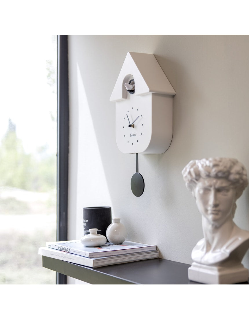 White Fisura Cuckoo Clock with traditional design and wooden details, featuring a small cuckoo bird on the front.