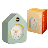 Green Fisura Little House alarm clock with a charming house design and classic clock face, perfect for bedside or decorative use.