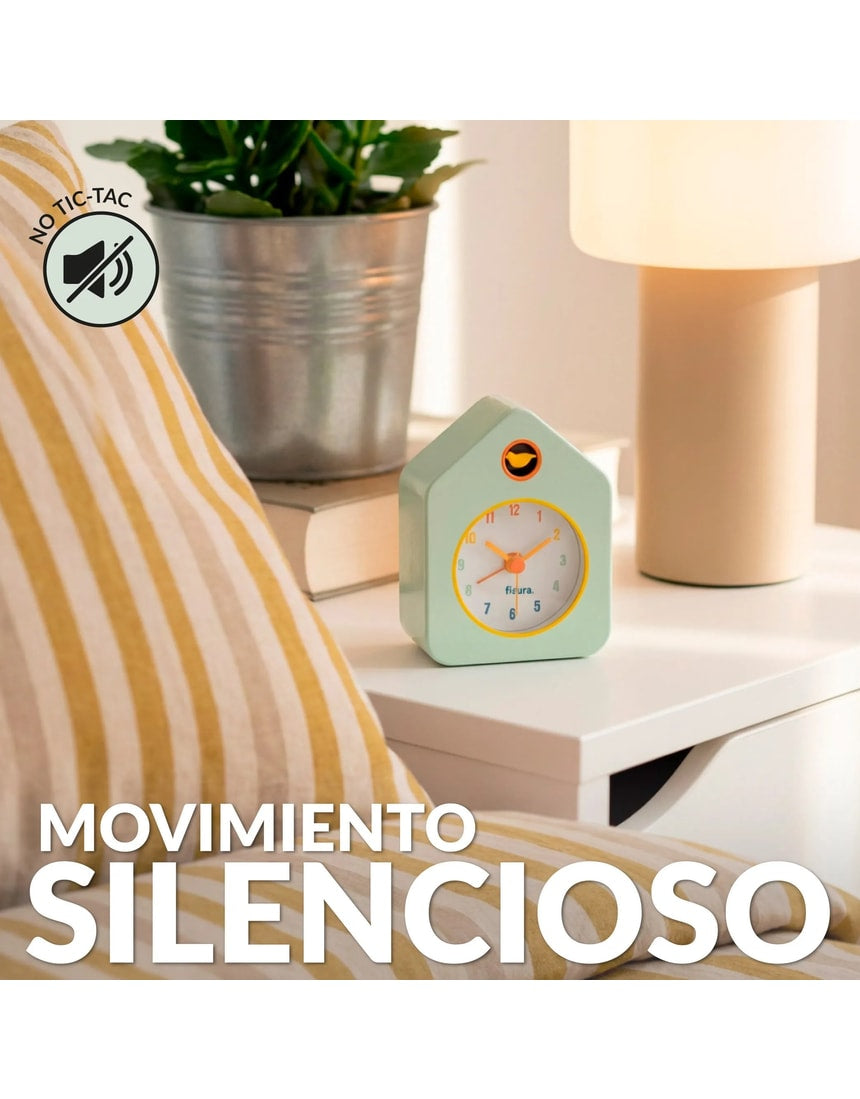Green Fisura Little House alarm clock with a charming house design and classic clock face on a wooden surface.
