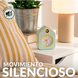 Green Fisura Little House alarm clock with a charming house design and classic clock face on a wooden surface.