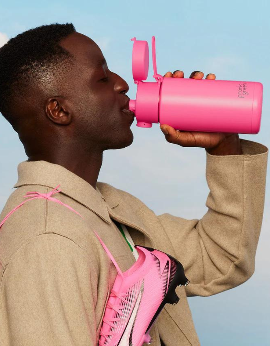Frank Green drinkwear switch lid with straw and strap, featuring a blush-colored lid for reusable bottles and eco-friendly use.