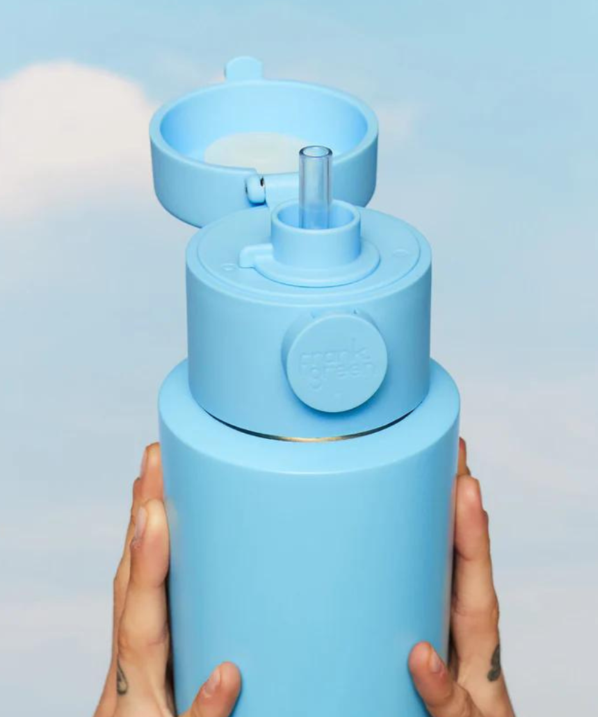 Frank Green drinkwear switch lid with straw and strap in blush color, featuring a secure fit and convenient carry strap.