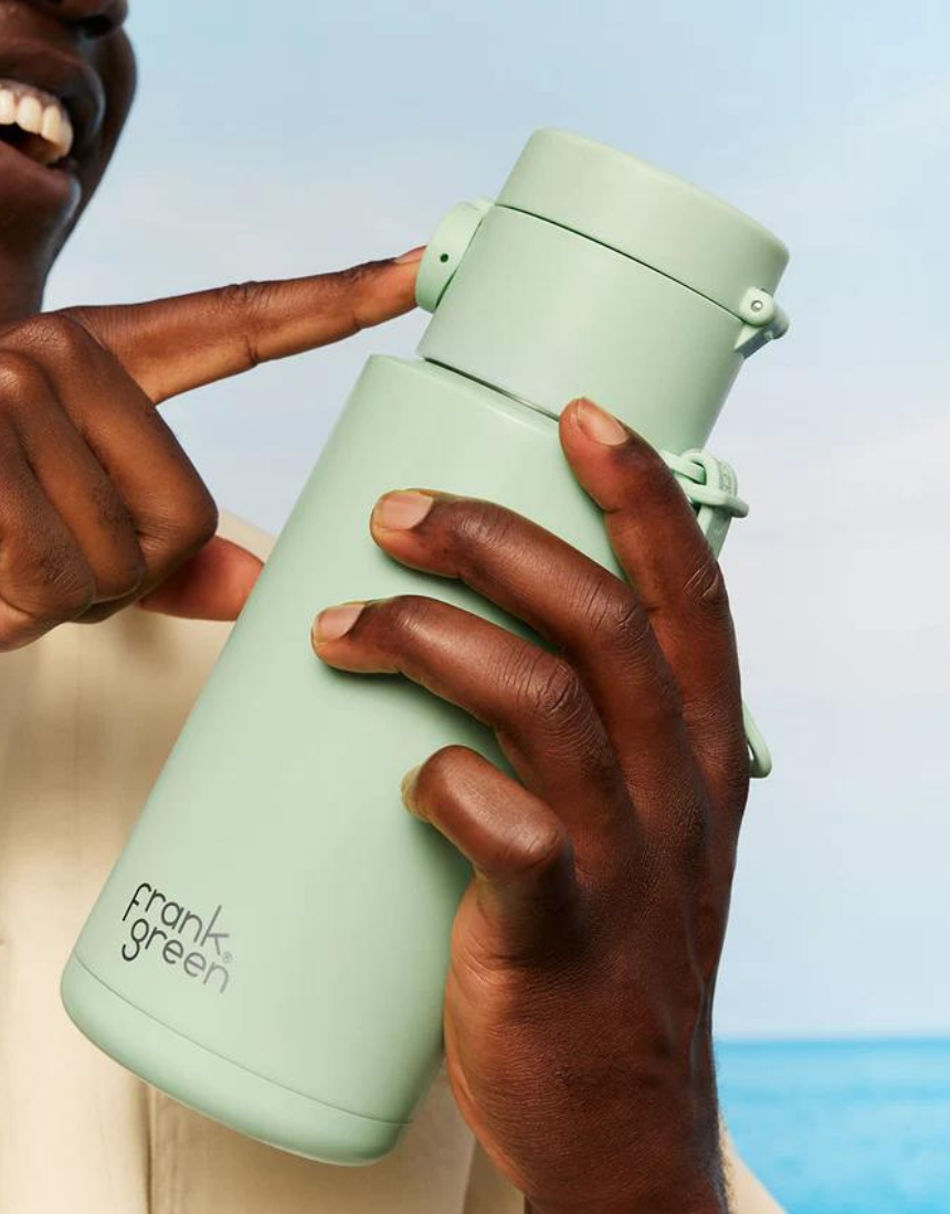 Frank Green drinkwear with switch lid, straw, and strap in blush color, featuring a sleek design for daily hydration.