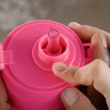 Frank Green drinkwear with switch lid, straw, and strap in blush color, showcasing the stylish, functional design.