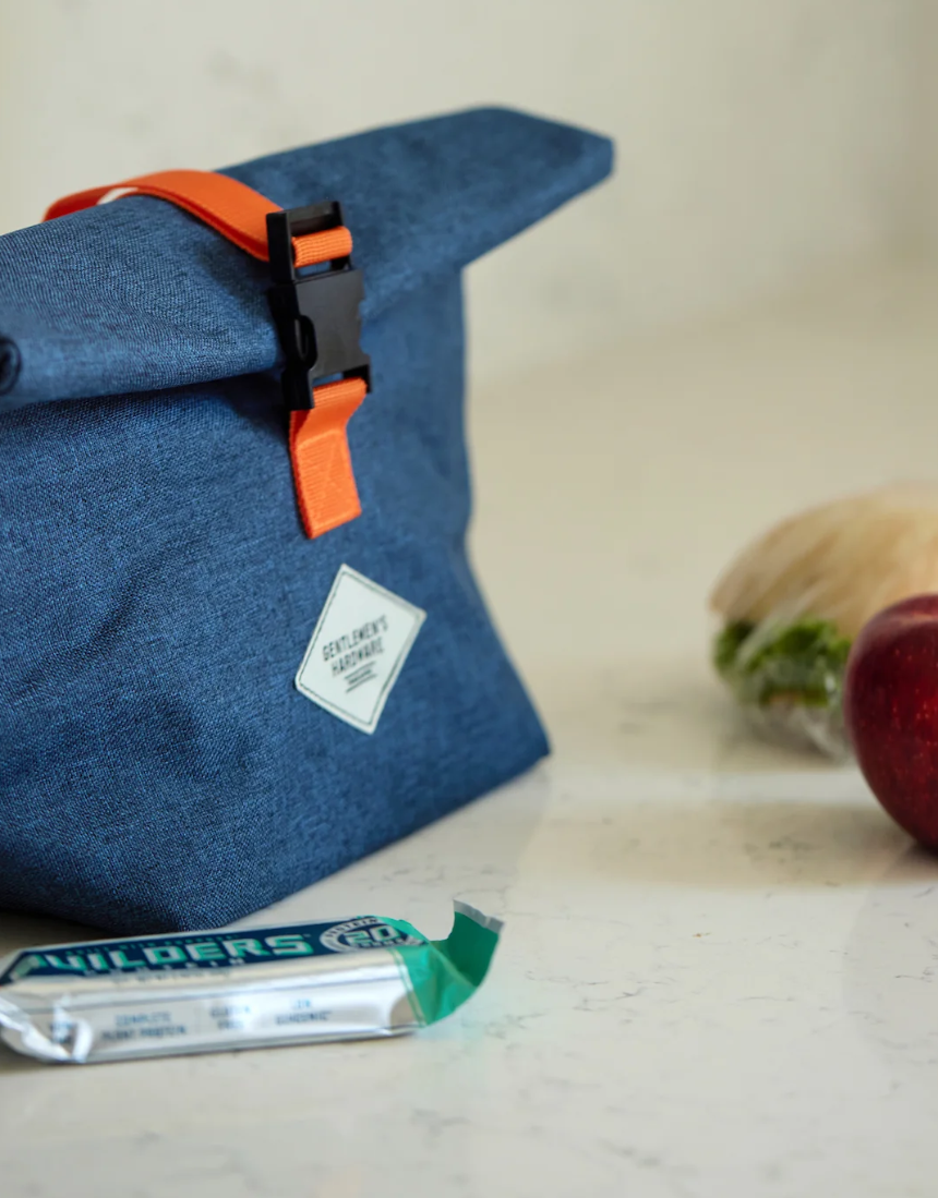 Gentlemen's Hardware roll-top lunch bag featuring durable fabric and a secure closure, ideal for carrying meals on the go.