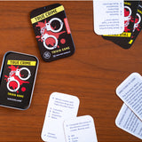 True Crime Trivia Tin by isAlbi showing a metal tin with trivia cards and related game accessories inside.