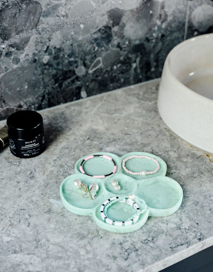 Greenwood Designs flower-shaped jewelry tray in mint color, perfect for organizing rings and necklaces.