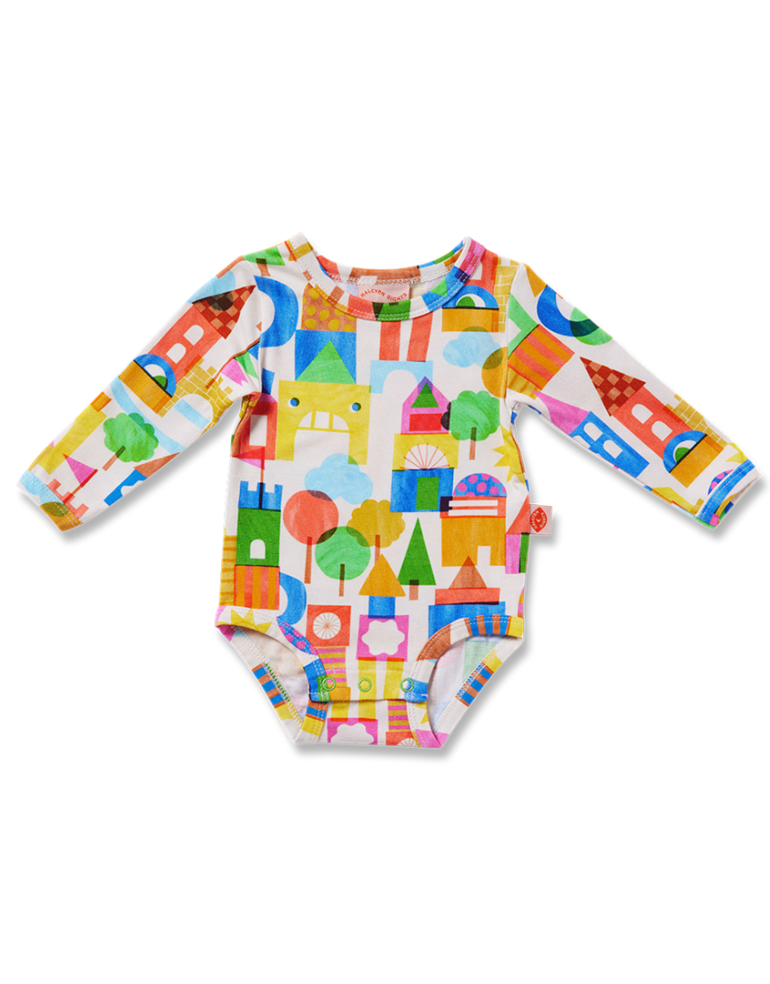 Baby long sleeve bodysuit by Halcyon Nights featuring a castle of dreams design, suitable for ages 0-3 months.