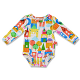 Baby long sleeve bodysuit by Halcyon Nights featuring a castle of dreams design, suitable for ages 0-3 months.