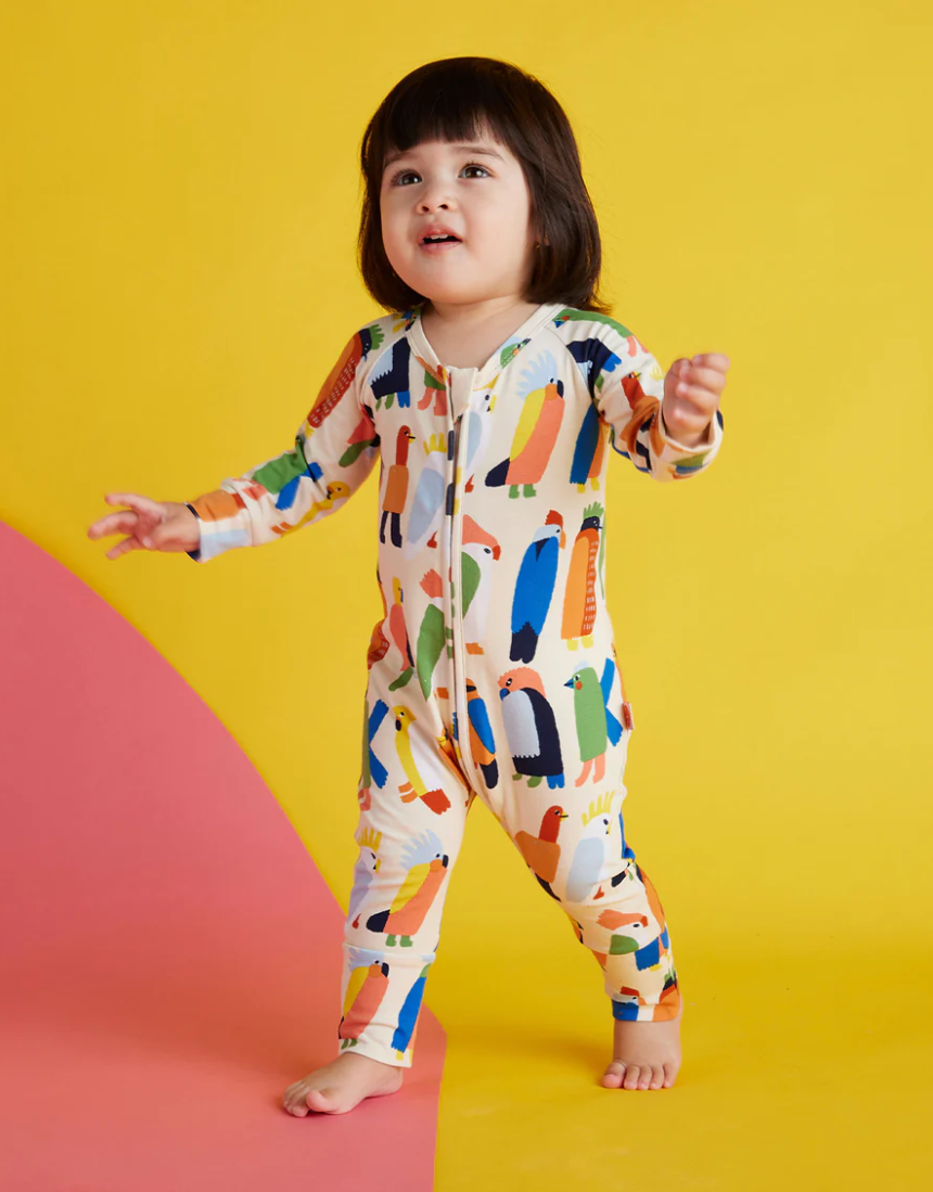 Baby Halcyon Nights Flamin' Galahs long sleeve zip suit with vibrant bird print, designed for newborns.