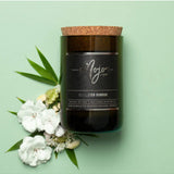 Himalayan Bamboo Black Label candle by Mojo Candle Co. with bamboo-themed packaging and a black label, flat lay arrangement.