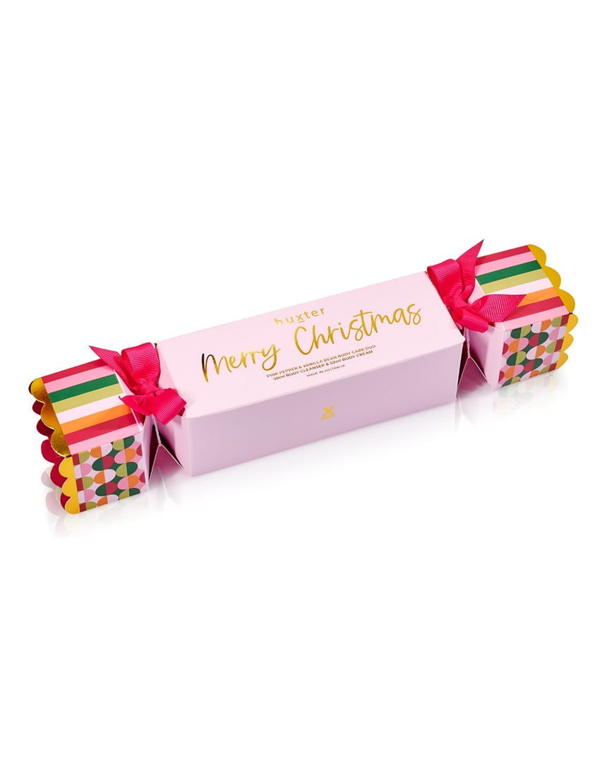 Huxter Adorned Christmas Body Care Bon Bon gift set with pink pepper and vanilla bean, featuring wrapped body care products in festive packaging.