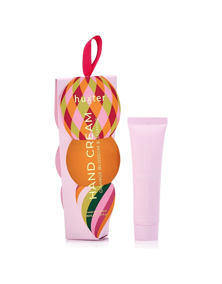 Huxter Adorned Christmas Hanging Hand Cream in soft pink with festive decorative packaging, perfect for holiday gift-giving.