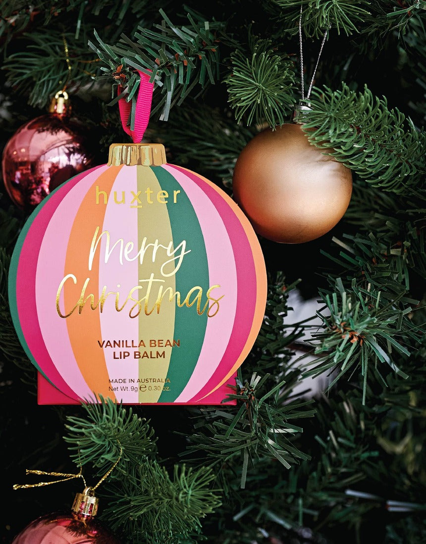 Huxter Adorned Christmas hanging lip balm in Mulberry flavor, featuring festive packaging with a decorative design.