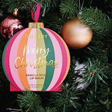 Huxter Adorned Christmas hanging lip balm in Mulberry flavor, featuring festive packaging with a decorative design.