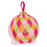Huxter Adorned Christmas Hanging Lip Balm in soft pink, decorative holiday packaging, hanging with festive decorations.