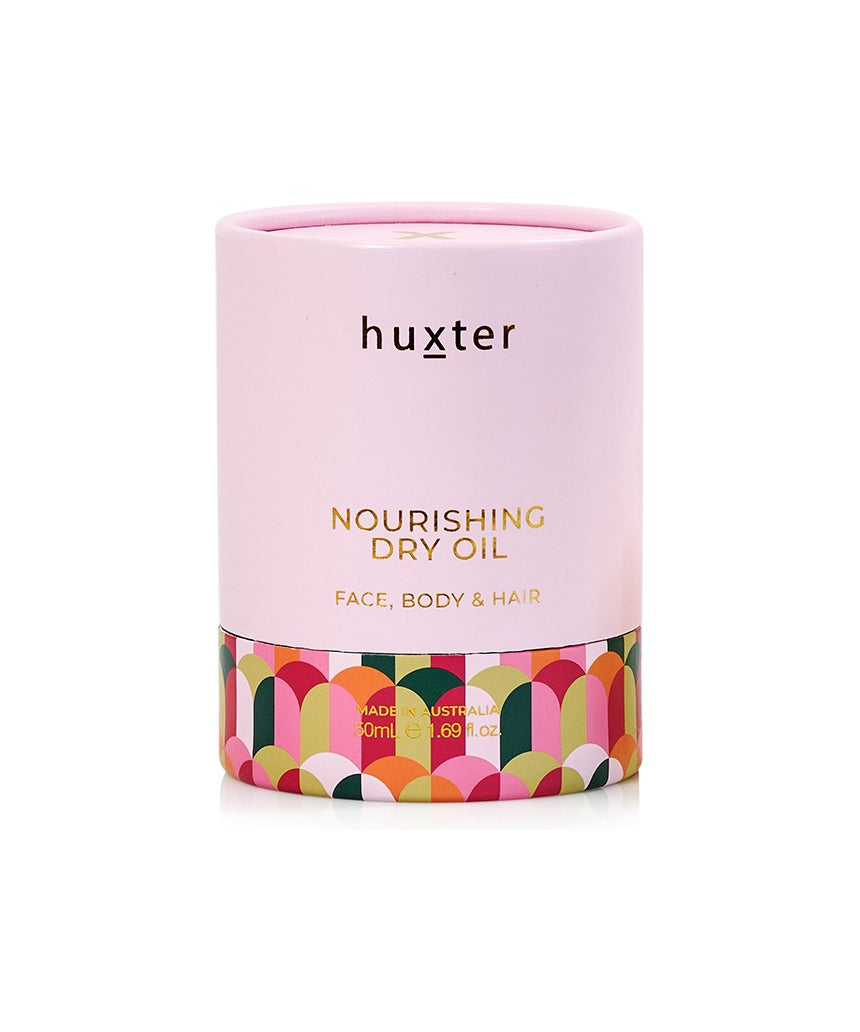 Huxter Adorned Christmas Nourishing Dry Body Oil bottle with decorative label, 50ml, highlighting hydrating skincare.