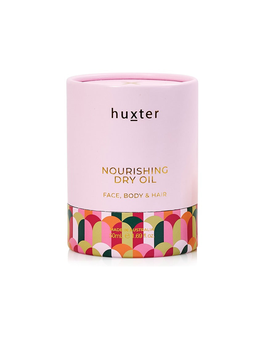 Huxter Adorned Christmas Nourishing Dry Body Oil bottle with decorative label, 50ml, highlighting hydrating skincare.