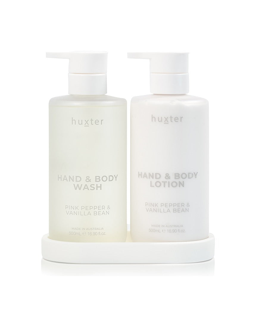 Huxter Adorned Christmas Bath & Body Gift Set featuring pink pepper and vanilla bean scented wash and lotion bottles.