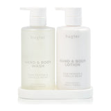 Huxter Adorned Christmas Bath & Body Gift Set featuring pink pepper and vanilla bean scented wash and lotion bottles.