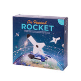 Kids' air powered rocket by isAlbi flying through the air with a blue body and red fins, demonstrating fun outdoor play.