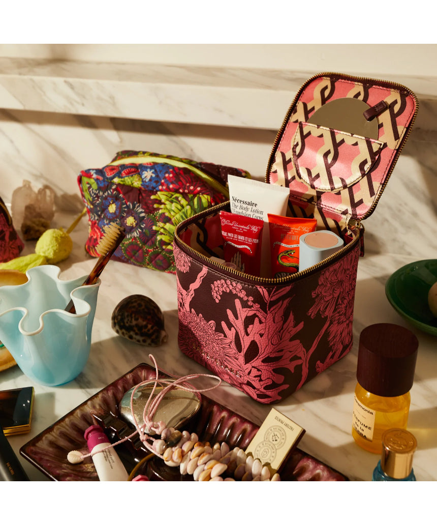 Sage x Clare Delphine Small Vanity Case in Garnet, a stylish cosmetic and toiletry bag with a textured fabric finish.