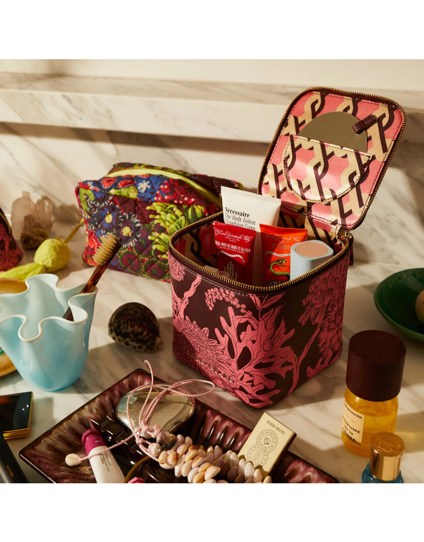 Sage x Clare Delphine Small Vanity Case in Garnet, a stylish cosmetic and toiletry bag with a textured fabric finish.