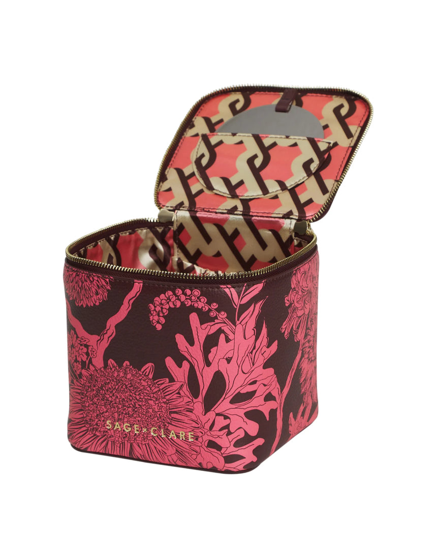 Sage x Clare Delphine Small Vanity Case in Garnet, a stylish cosmetic and toiletry bag with a vibrant red design.