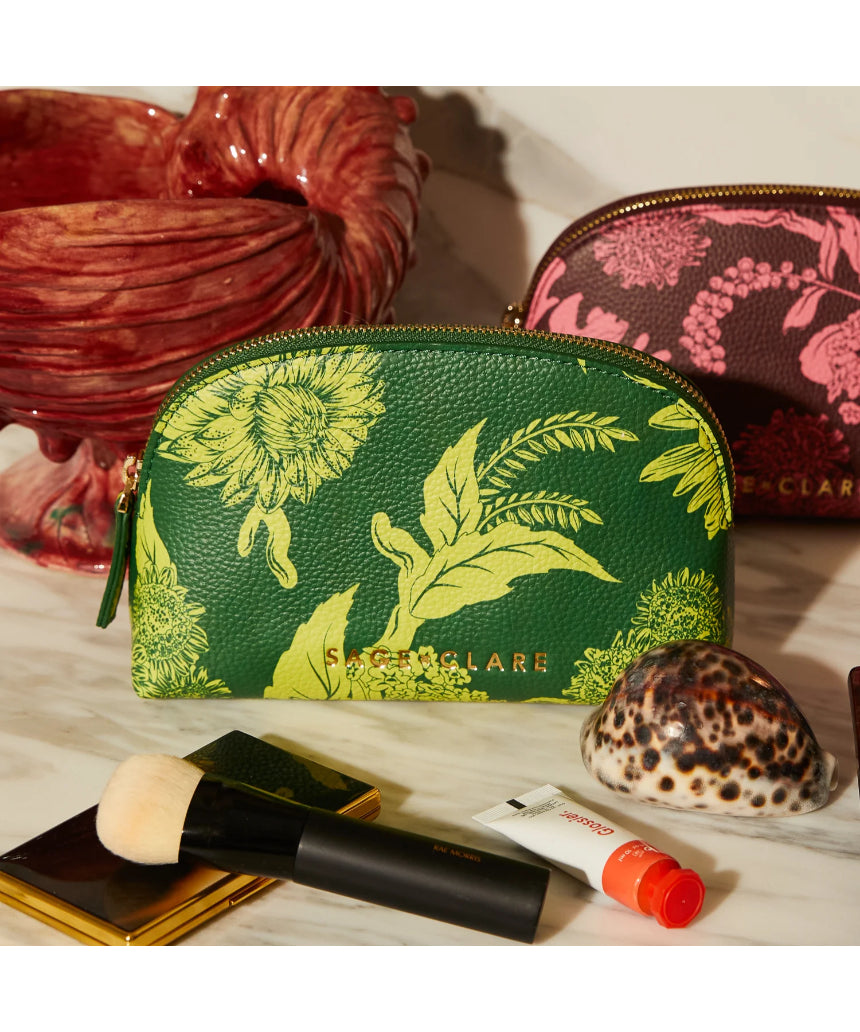 Sage x Clare Delphine Anise cosmetic pouch with floral pattern, soft fabric exterior, and zipper closure for toiletries and makeup storage.