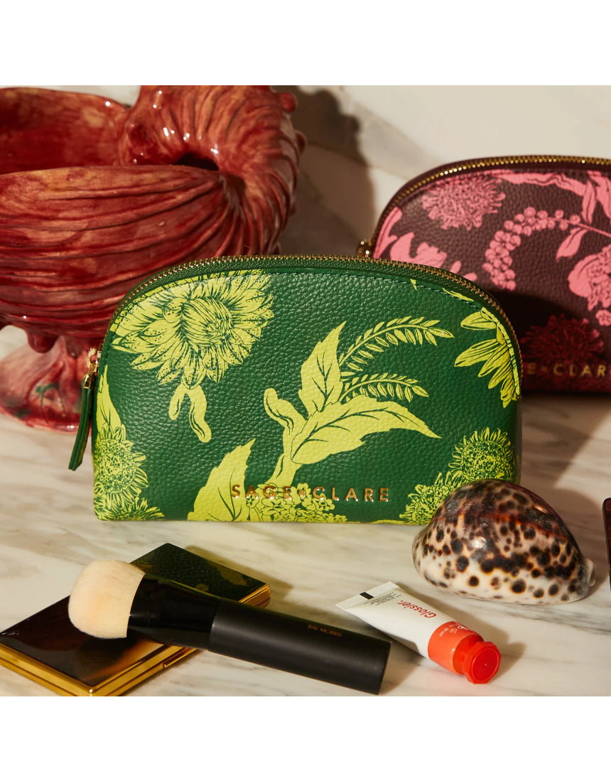 Sage x Clare Delphine Anise cosmetic pouch with floral pattern, soft fabric exterior, and zipper closure for toiletries and makeup storage.