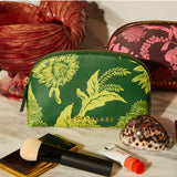 Sage x Clare Delphine Anise cosmetic pouch with floral pattern, soft fabric exterior, and zipper closure for toiletries and makeup storage.