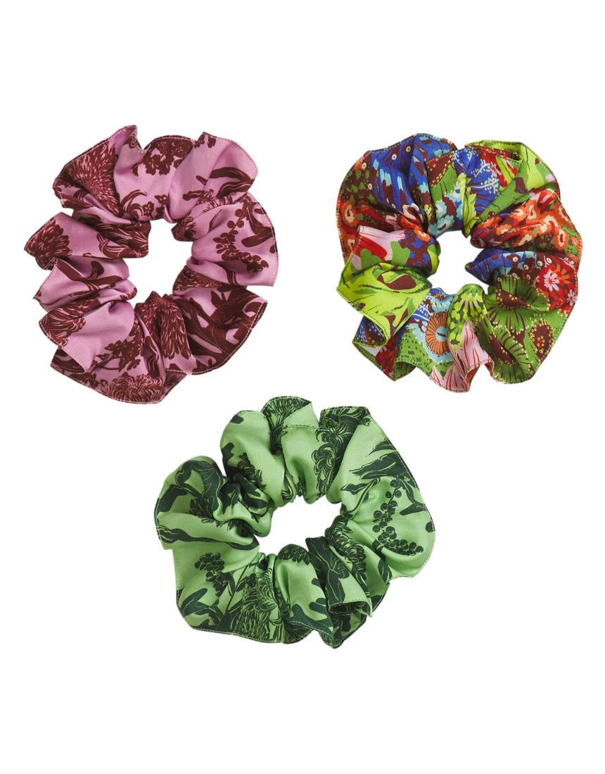 Set of Sage x Clare Delphine silk scrunchies in soft pastel colors, displayed together on a neutral background.