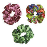 Set of Sage x Clare Delphine silk scrunchies in soft pastel colors, displayed together on a neutral background.