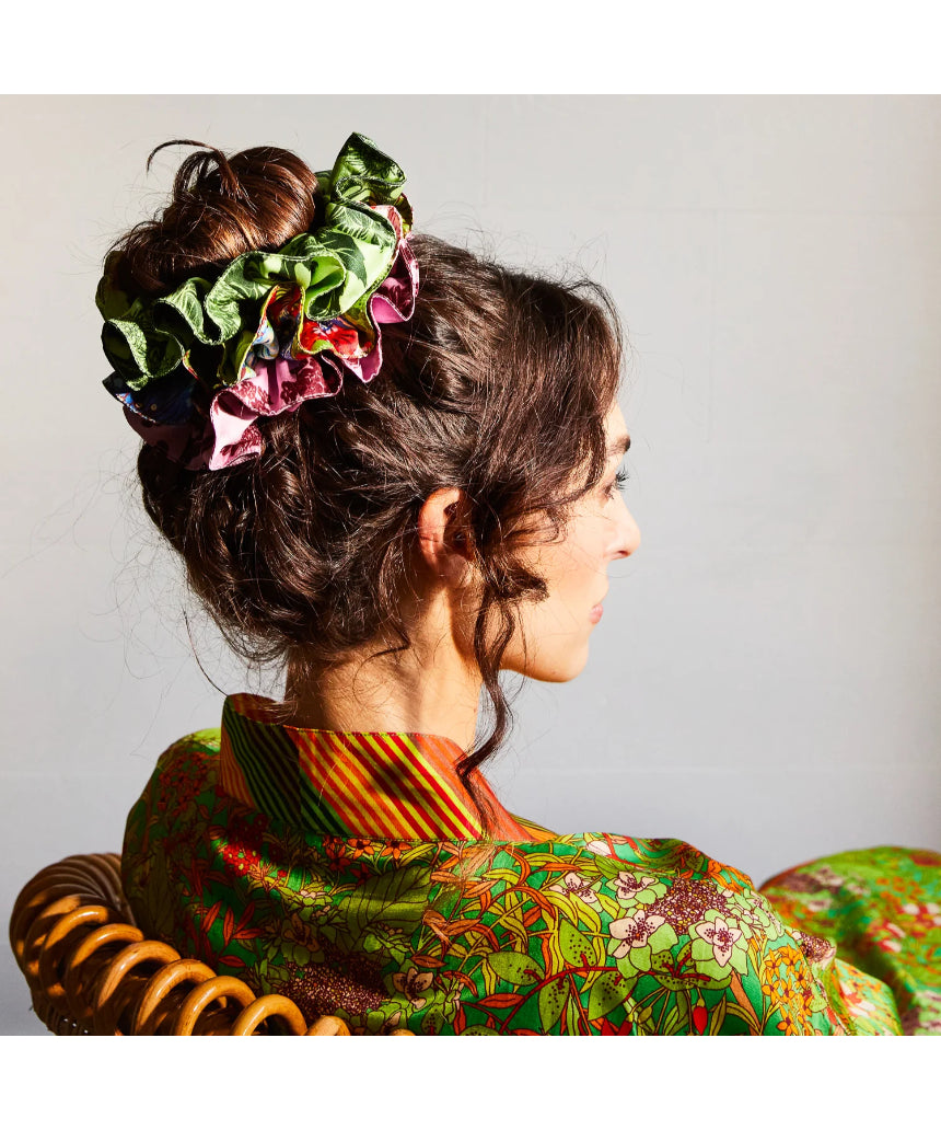 Sage x Clare Delphine silk scrunchie set with multiple soft, colorful fabric scrunchies displayed on a neutral background.