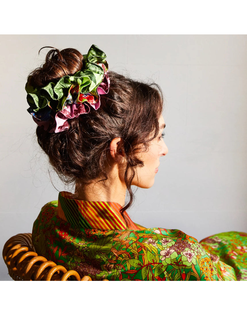 Sage x Clare Delphine silk scrunchie set with multiple soft, colorful fabric scrunchies displayed on a neutral background.