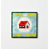 Colorful wall art tile from Jones & Co featuring a fun house design, perfect for kids' room decor.